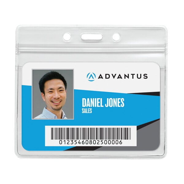 A man's name tag in a clear plastic holder with a picture of a man and the name Daniel Jones.