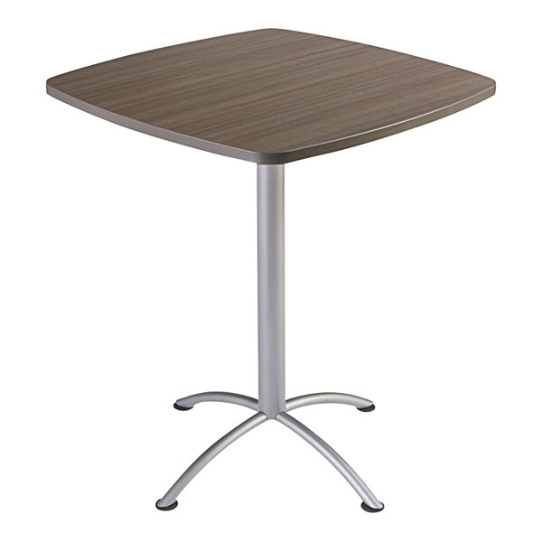 An Iceberg square cafe table with a metal base and natural teak laminate top.