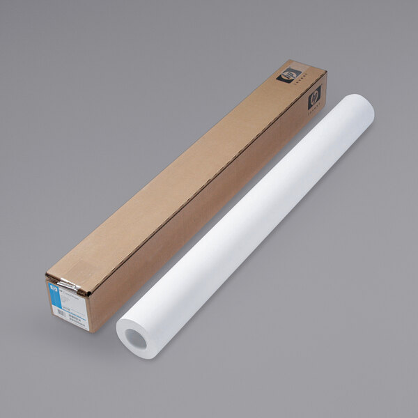 A long cardboard box with a roll of HP DesignJet coated white paper next to it.