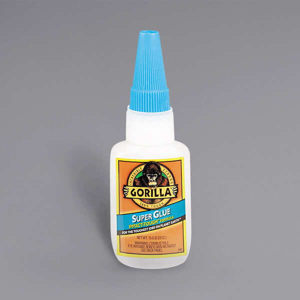 A white Gorilla Glue bottle with a blue cap.