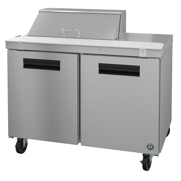 A stainless steel Hoshizaki refrigerated counter with two doors.