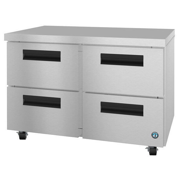 A stainless steel metal cabinet with drawers on wheels.
