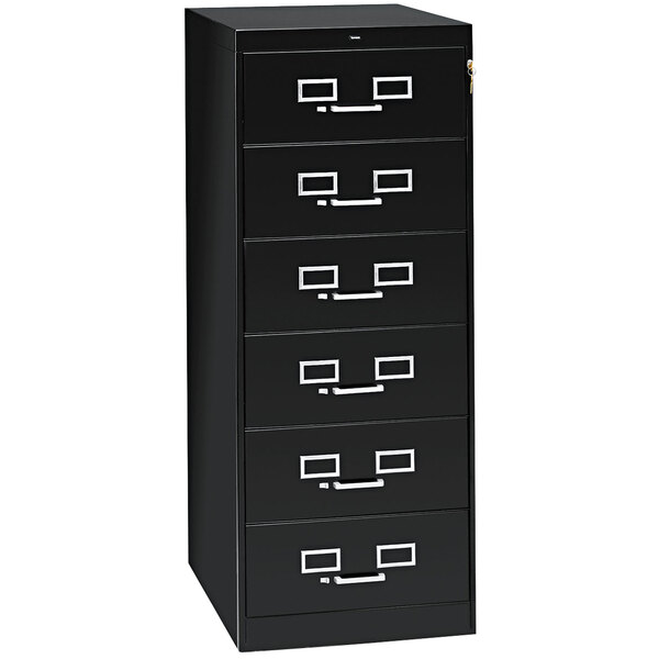 A black Tennsco multimedia cabinet with six drawers and silver handles.