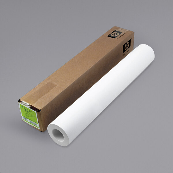 A HP DesignJet large format paper roll next to a box with a white background.