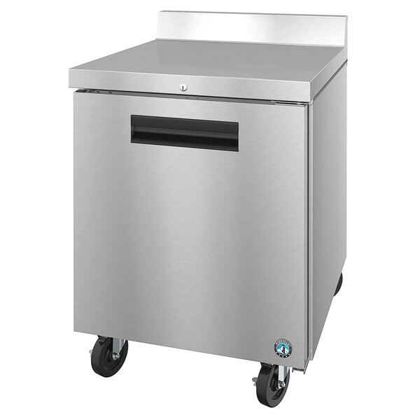 A silver Hoshizaki worktop refrigerator with black wheels and a black handle.