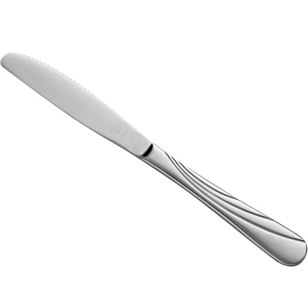 A Libbey stainless steel dinner knife with a fluted blade and a silver handle.