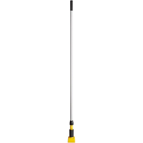 A long Rubbermaid mop handle with a yellow jaw.
