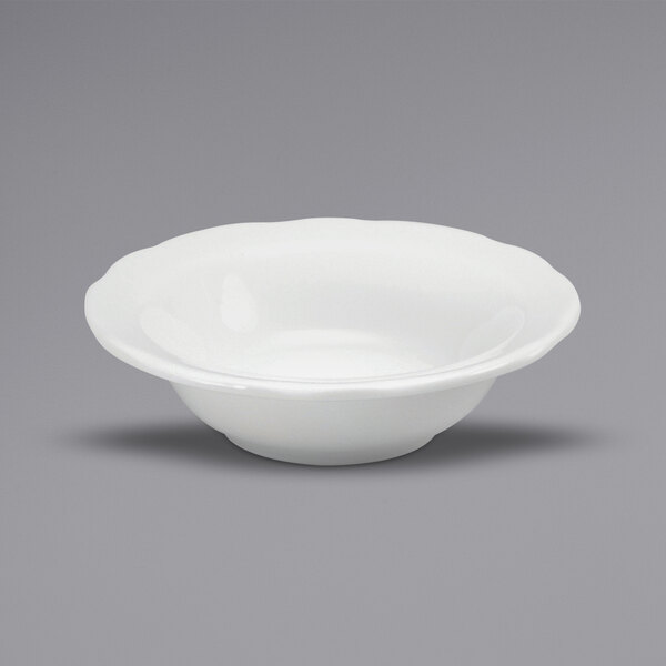 A white Oneida Buffalo Caprice china bowl with a scalloped edge.
