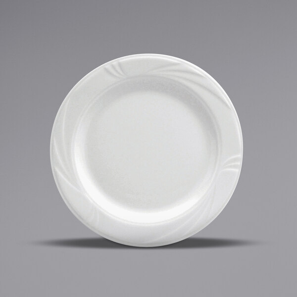 A close-up of a Oneida Buffalo Arcadia white porcelain plate with a swirl design.