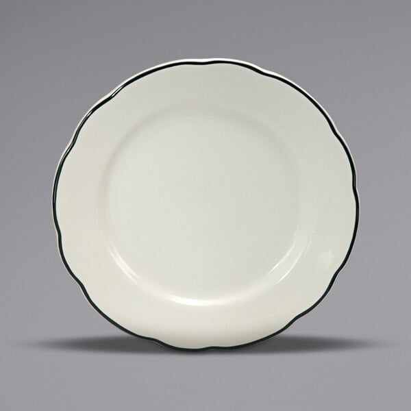 A white Oneida Buffalo Caprice china plate with a scalloped edge and black trim.