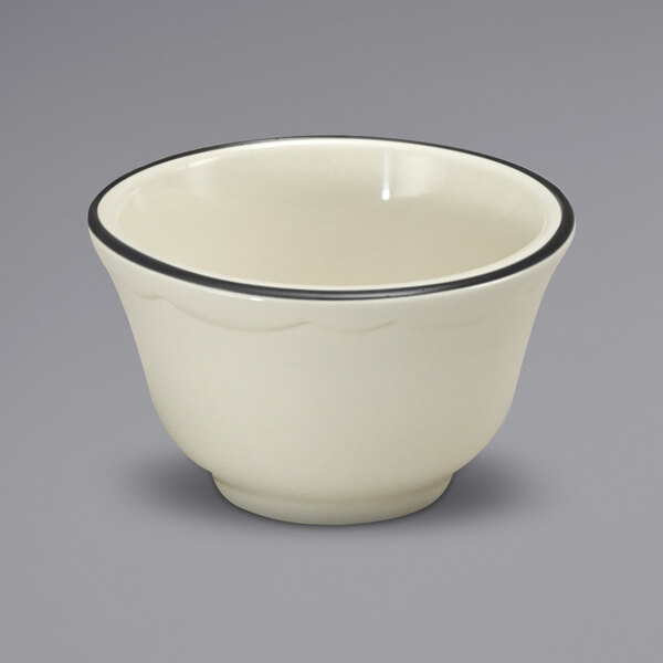 A white Oneida buffalo china bouillon bowl with a black rim.