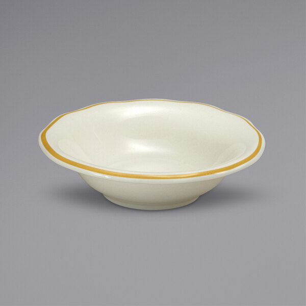 A white bowl with a gold rim.