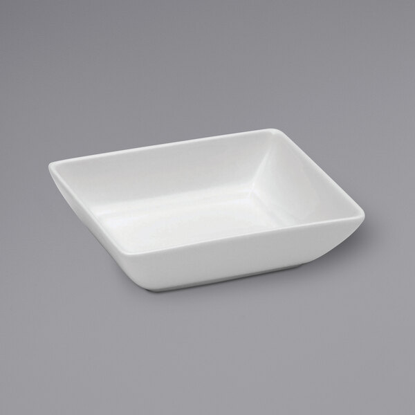 Oneida Buffalo Bright White Ware rectangular porcelain bowl on a gray surface.