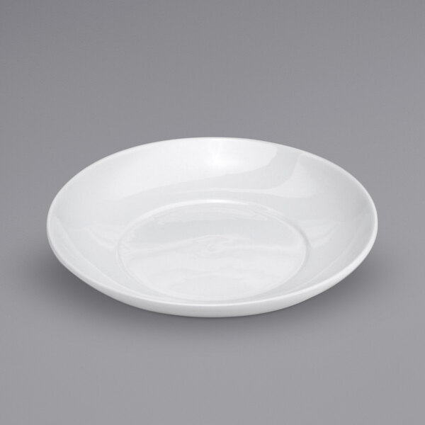 A close-up of a Oneida Buffalo white porcelain soup bowl on a gray surface.