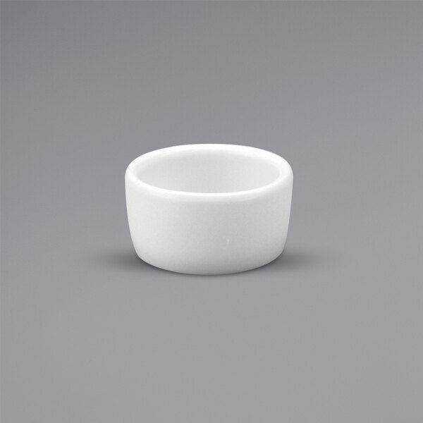A white round Oneida Buffalo Bright White Ware porcelain ramekin.