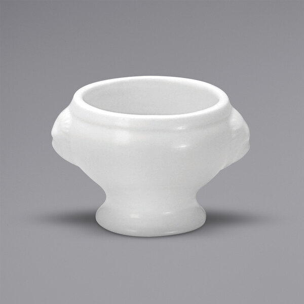 A close up of a white Oneida Buffalo porcelain bowl with a lion head handle.