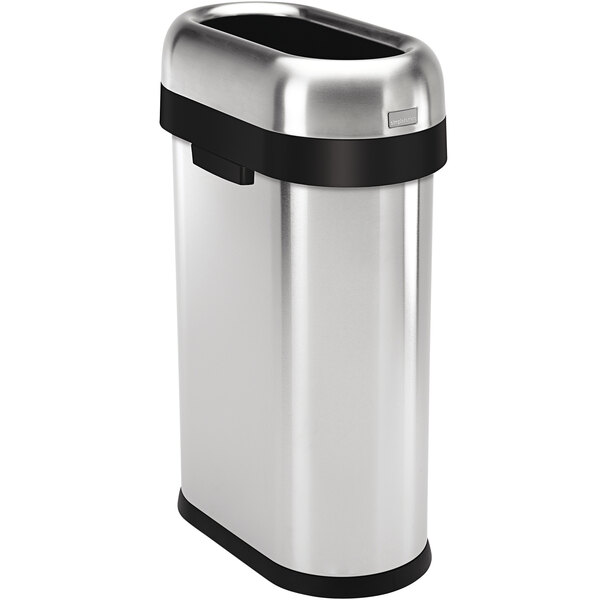 A brushed stainless steel simplehuman oval trash can with black trim.
