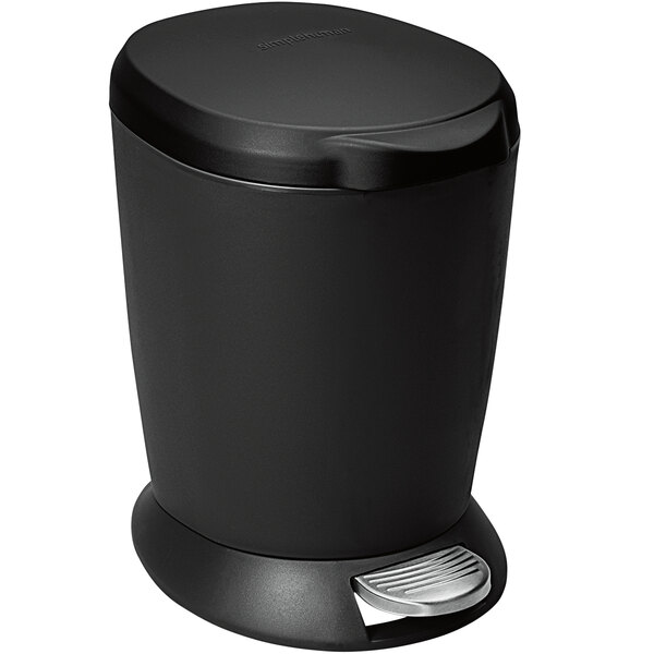 A black simplehuman round step-on trash can with a pedal lid.