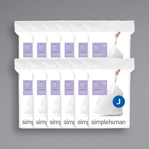 A group of packages of white simplehuman custom fit trash can liners.