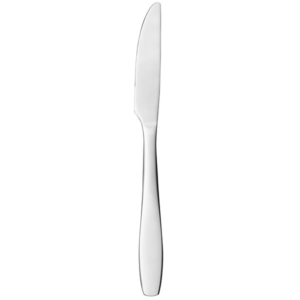 A silver Libbey Cresswell dinner knife with a solid handle and serrated blade.