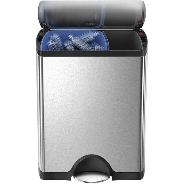 A simplehuman stainless steel rectangular dual compartment trash can with plastic bottles inside.