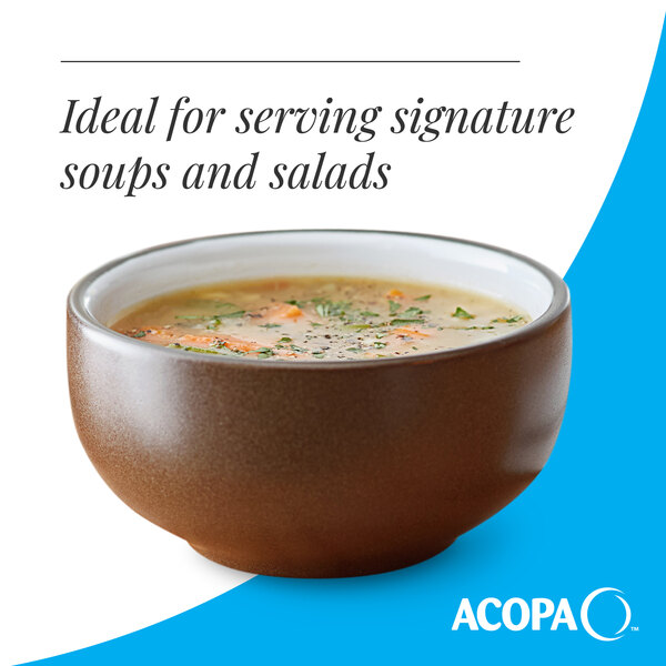 A brown matte stoneware bowl filled with soup.