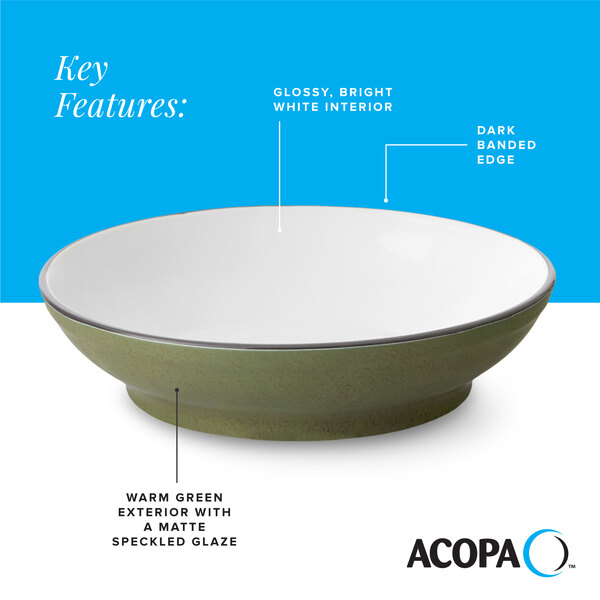 A stoneware pasta bowl with a glossy white interior, dark banded edge, and a warm green matte speckled exterior.