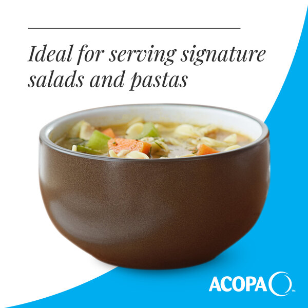 A brown matte stoneware bowl filled with soup.