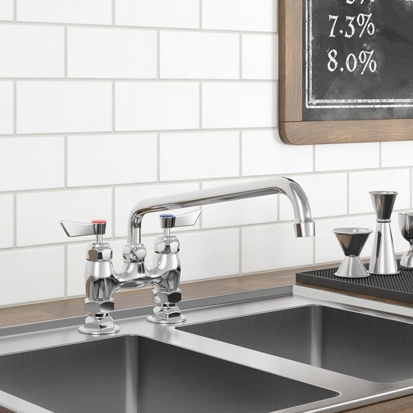 A Waterloo deck-mounted faucet with 4" centers and 12" swing spout on a counter above a sink with a chalkboard on the wall.