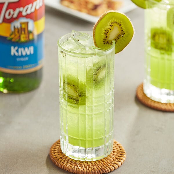 A glass of green kiwi juice with Torani Kiwi syrup.