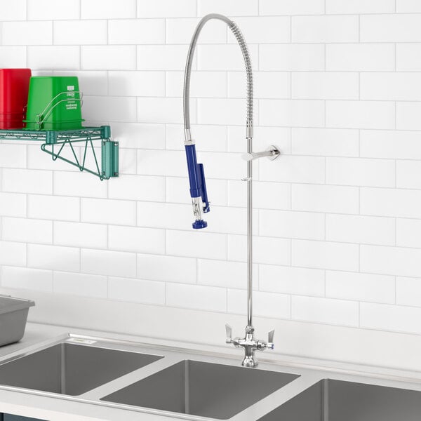 A Waterloo deck-mounted pre-rinse faucet over a sink.