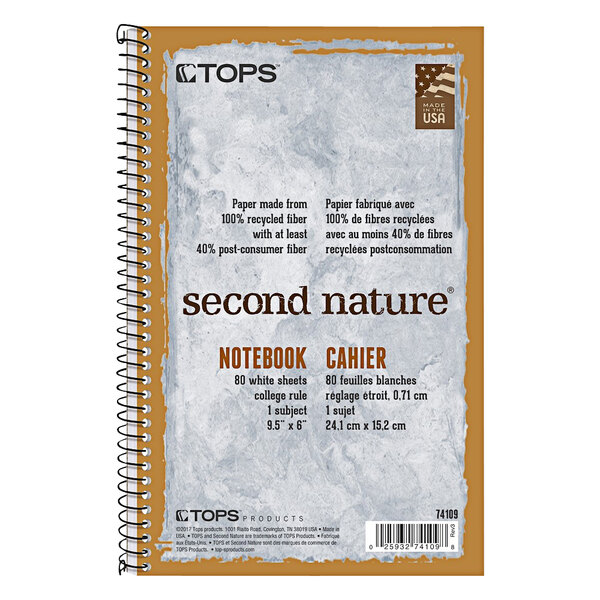 A white spiral bound notebook with the words "Second Nature" on the cover.