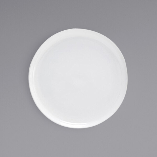 A Front of the House bright white porcelain plate with a small hole in the middle.