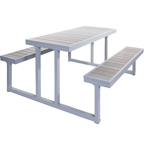 A BFM Seating metal picnic table with benches.