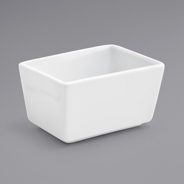 A white square container on a gray surface.
