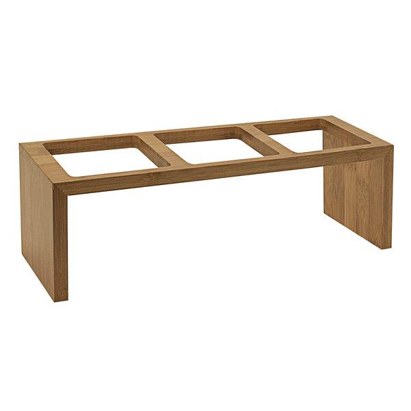 A natural bamboo rectangular stand with three square holes.