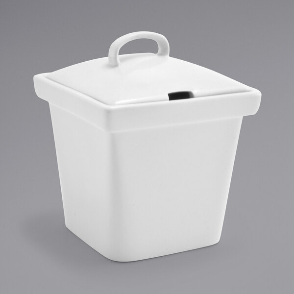 A white square porcelain pot with a notched lid.