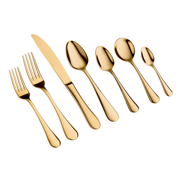 A set of seven gold-colored utensils, including two forks, one knife, and four spoons, arranged in a row on a white background.