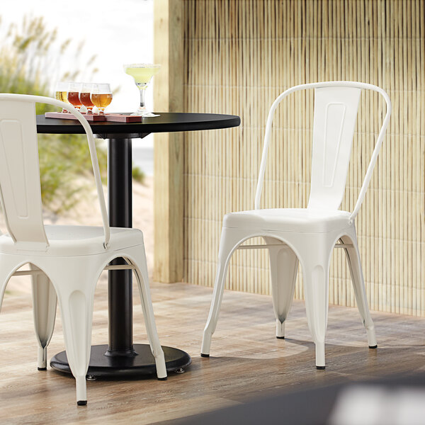 Lancaster Table & Seating Alloy Series White Metal Indoor / Outdoor Industrial Cafe Chair with Vertical Slat Back and Drain Hole Seat