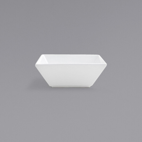 A white square bowl on a gray background.
