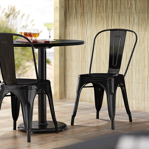 Lancaster Table & Seating Alloy Series Black Metal Indoor / Outdoor Industrial Cafe Chair with Vertical Slat Back and Drain Hole Seat