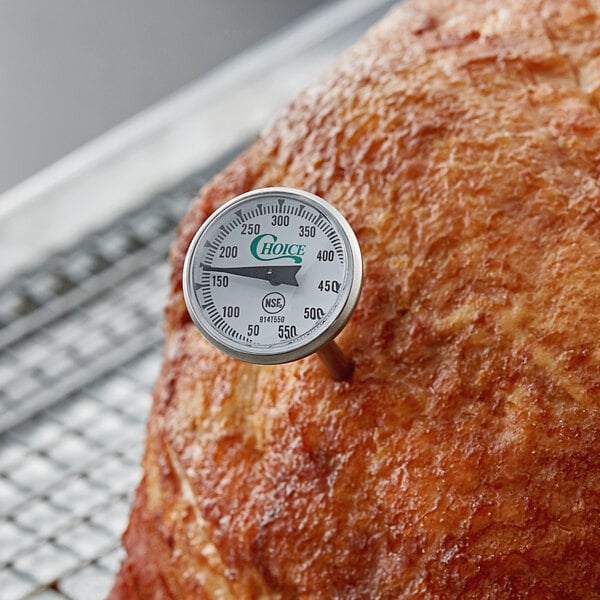 A Choice 5" pocket probe dial thermometer in a meat roast.