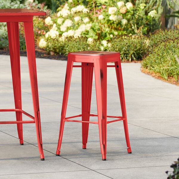 Lancaster Table & Seating Alloy Series Distressed Ruby Red Outdoor Backless Barstool
