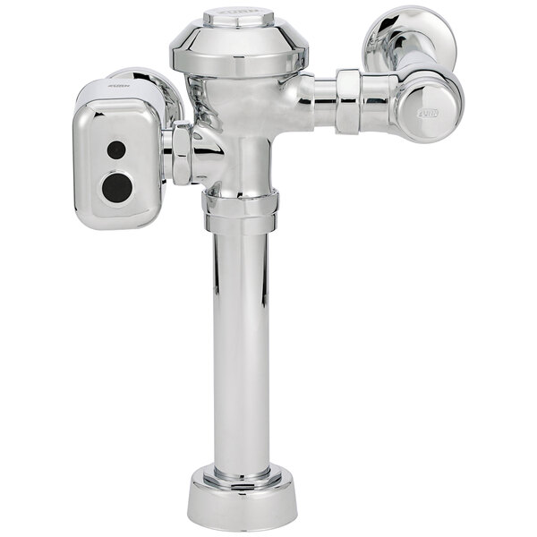 A Zurn chrome plated metal urinal flush valve with hardwired automatic sensor.