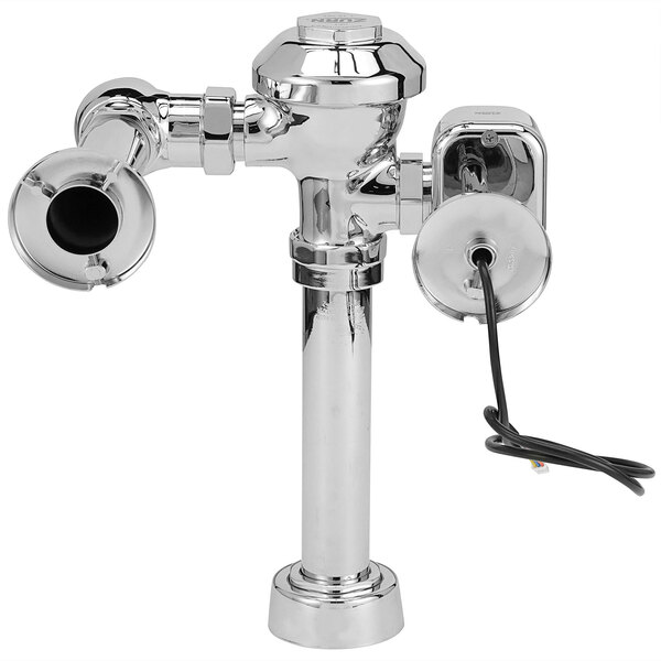A Zurn chrome toilet flush valve with a hardwired automatic sensor.