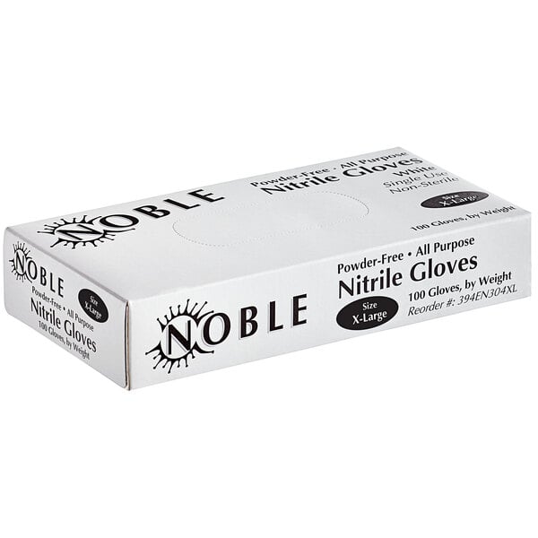 A white Noble Products Nitrile gloves box with black text on a counter.