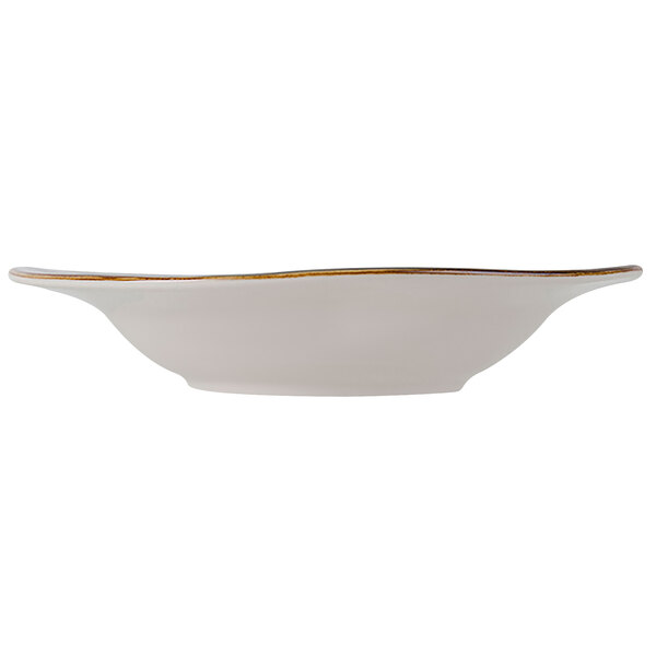 A white Tuxton china bowl with gold trim on the rim.
