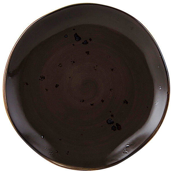 A black china plate with a brown swirl pattern.