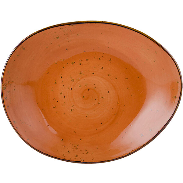 A white China plate with an orange geode swirl pattern.