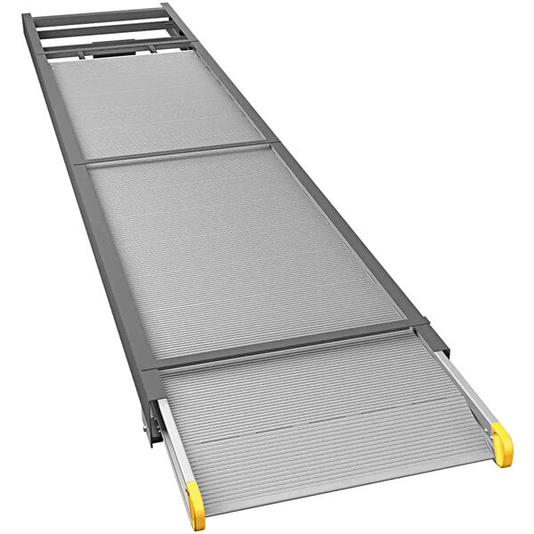 A grey metal Magliner ramp with yellow handles.